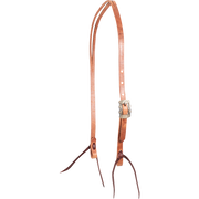 Natural harness leather split ear headstall with a Prescott buckle, seen from the front quarter. The engraved square buckle with scalloped edges sits on the cheek, above latigo bit ties.