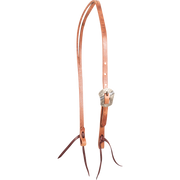Natural harness leather split ear headstall with a Salinas buckle, seen from the front quarter. The engraved, shaped buckle sits on the cheek of the 5/8-inch strap above latigo bit ties.