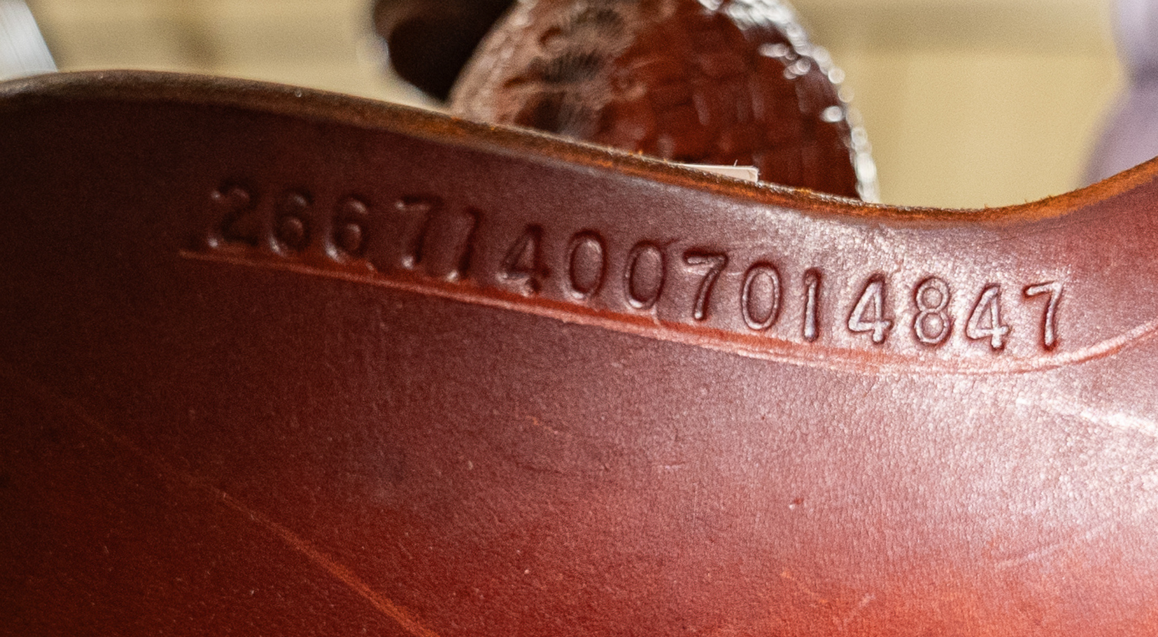 Martin Saddlery FX3 barrel saddle serial number 266714007014847, decoded as a 2026 model with a 14-inch seat and 7-inch gullet, illustrating how to read a Martin saddle serial number stamp.
