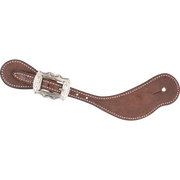 Chocolate roughout cowboy spur strap with a Prescott buckle, seen from above. White stitching outlines the strap, and the scalloped engraved buckle sits near the narrow end.