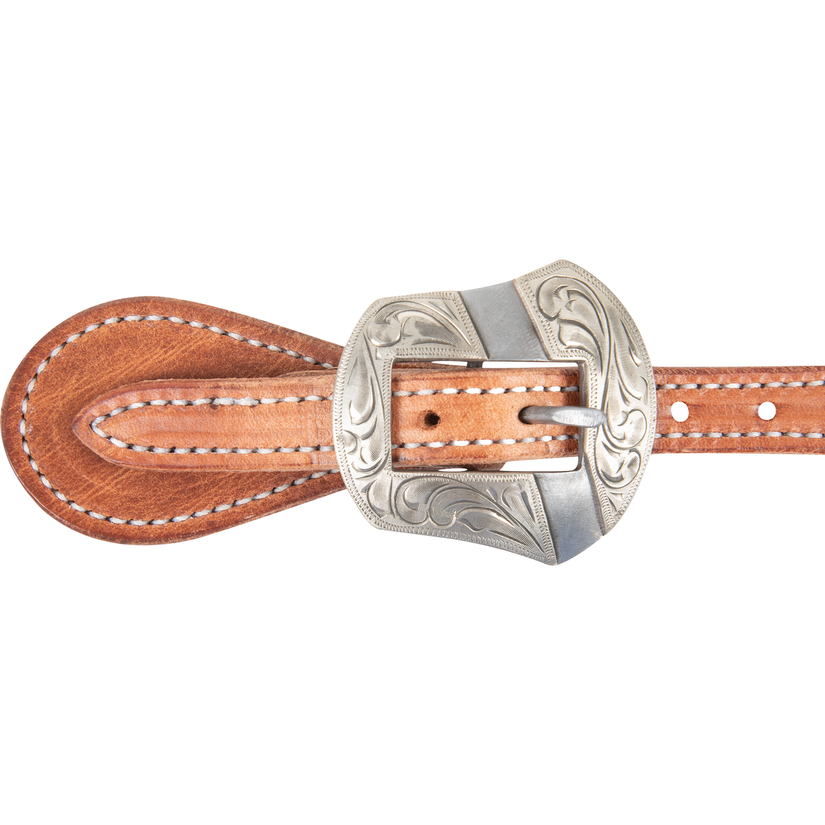 Salinas buckle on a natural harness leather spur strap, seen up close. Scroll engraving covers the shaped buckle, with white stitching on the strap around it.