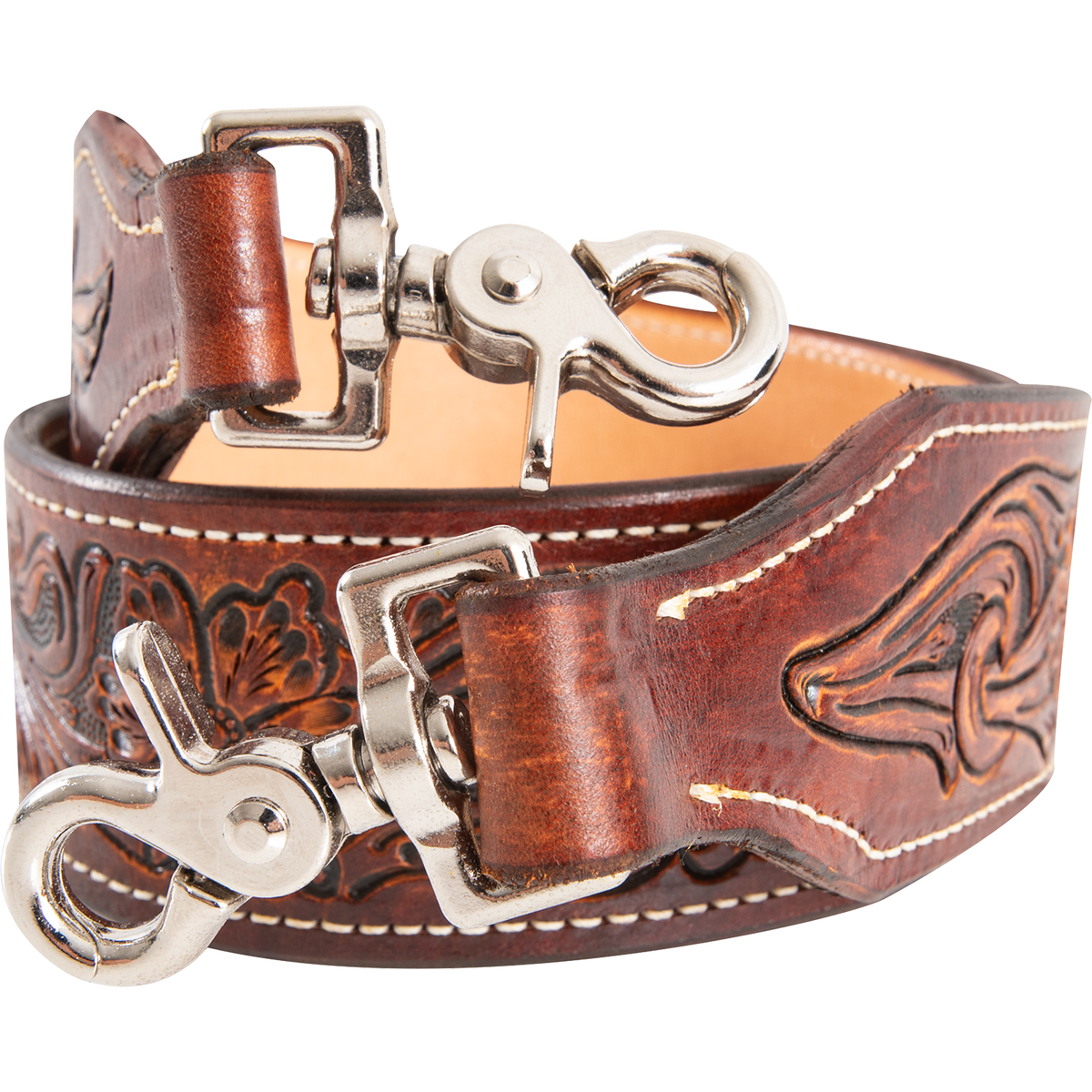 Swivel snaps on a rolled floral tooled rope can strap, seen up close. The chestnut leather folds through each snap, with white stitching around the tooled ends.