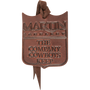 Leather air freshener, seen from the front. The brown shield shaped leather is stamped with the Martin Saddlery name and the words The Company Cowboys Keep, with a leather hanging tie.