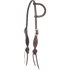 Chocolate roughout split ear headstall with rosette strings, seen from the front quarter. White stitching outlines the shaped cheeks, which carry cart buckles and end in leather rosettes with latigo bit ties.