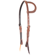 Harness leather slip ear headstall seen from the front quarter. The 3/4-inch straps are doubled and stitched with dark latigo lining, with buckles at the cheeks and bit ties.
