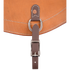 Flank cinch hobble strap attached to the center ring of a natural leather flank cinch, seen up close. The dark strap fastens with a roller buckle below the ring.