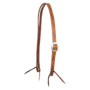 Ranahan headstall in natural skirting leather with weathered, antiqued vine tooling, seen from the front quarter. The tooled cheek carries a cart buckle, and both ends finish in bit ties.