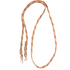 Tan-brown braided nylon roping rein, looped and seen from above. Brown flecks mark the tan waxed nylon braid, which adjusts with buckles and ends in snaps.