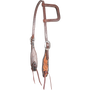 Dyed edge and tooled slip ear headstall, seen from the front quarter. Natural floral tooling fills the shaped cheek ends inside dark dyed edges, with a stitched ear loop, buckles and bit ties.