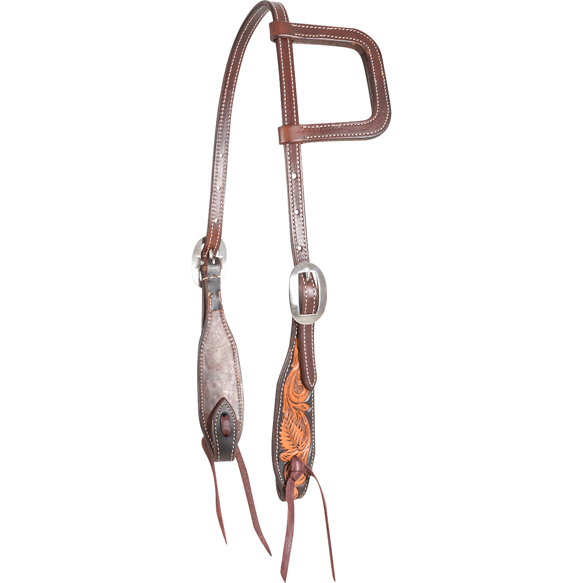 Dyed edge and tooled slip ear headstall, seen from the front quarter. Natural floral tooling fills the shaped cheek ends inside dark dyed edges, with a stitched ear loop, buckles and bit ties.