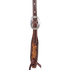 Natural floral tooled headstall cheek seen up close, with a cart buckle above a tooled end and a latigo bit tie. Chocolate-framed edges and white stitching surround the tooling.