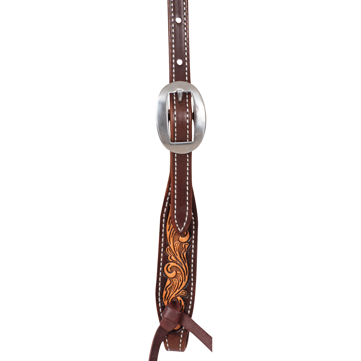 Natural floral tooled headstall cheek seen up close, with a cart buckle above a tooled end and a latigo bit tie. Chocolate-framed edges and white stitching surround the tooling.