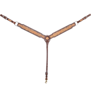Natural skirting leather breastcollar with a brown frame, seen from the front in full. The 2.5-inch shoulder straps show floral tooling inside chocolate-framed edges and meet at a center ring above a tie-down strap with a snap.