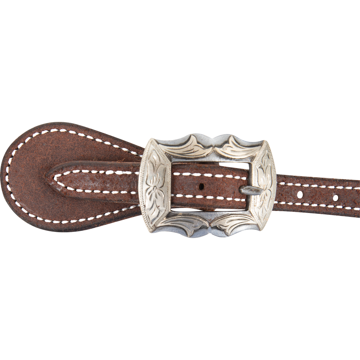 Prescott buckle on a chocolate roughout spur strap, seen up close. Engraving covers the scalloped buckle frame, with white stitching on the leather around it.
