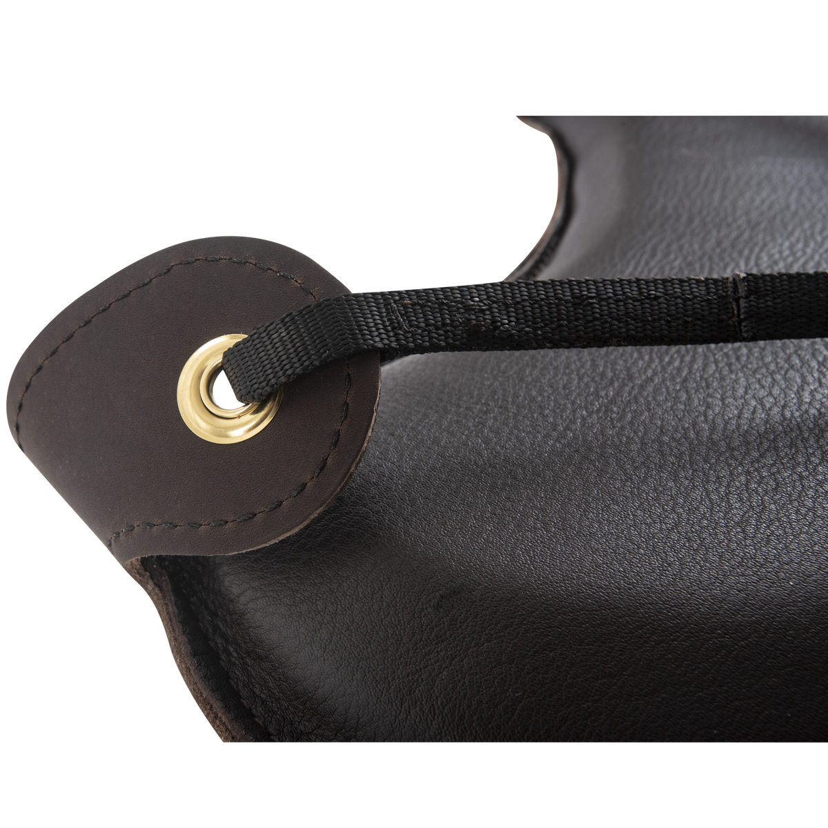 Corner of a leather seat shrinker, seen up close. A black strap passes through a grommet in the stitched leather tab.