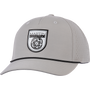 Silver performance cap seen from the front at a slight angle. A black and white Martin Saddlery shield patch sits on the structured crown, with a black rope across the precurved bill and perforated side panels.