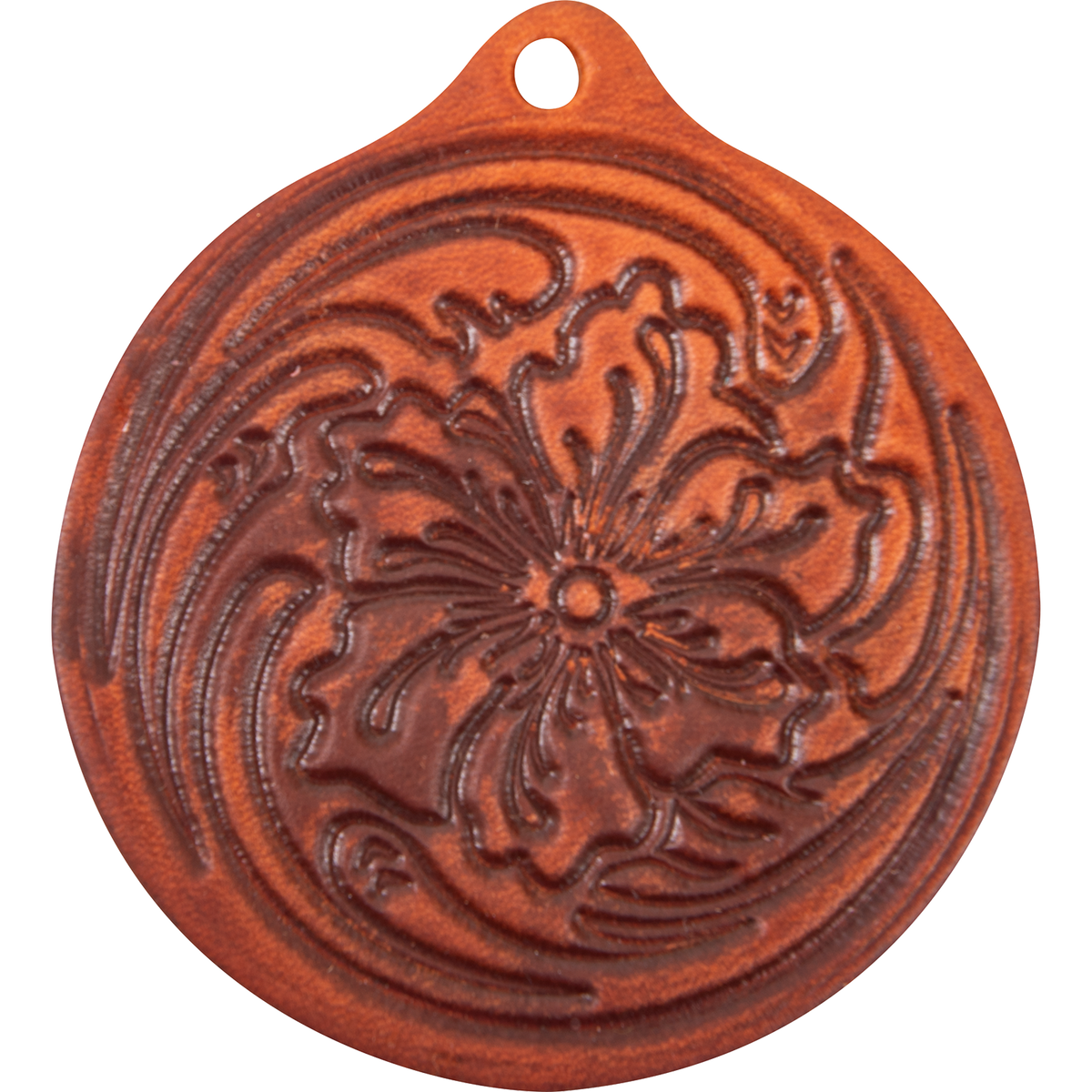 Round leather air freshener in a light reddish brown, seen from the front. Floral tooling with swirling leaves covers the face below the hanging hole.