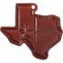 Leather air freshener shaped like Texas in a reddish brown, seen from the front. A star and flag lines are pressed into the face.