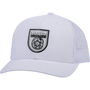 White trucker cap seen from the front at a slight angle. A black shield logo patch reading Martin Saddlery sits on the front panels, with a precurved bill and a white mesh back.